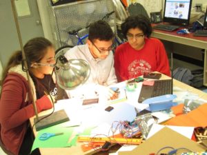 Three of Clara's current InvenTeam students learning to code the processor for their Mosquito Breeding Disruptor (December 2017)